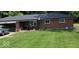 Charming single-story brick home with a well-maintained lawn and attached garage at 8990 N 850 W, Fairland, IN 46126
