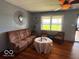 Inviting living room with hardwood floors, featuring cozy seating and bright, natural light at 8990 N 850 W, Fairland, IN 46126