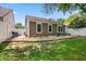 Spacious backyard featuring a patio seating area, grassy lawn, and white privacy fence at 9700 River Oak E Ln, Fishers, IN 46038