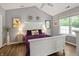 Comfortable bedroom featuring a white bed frame and a ceiling fan at 9700 River Oak E Ln, Fishers, IN 46038