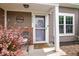 Inviting front entrance with a decorative welcome sign and charming decor at 9700 River Oak E Ln, Fishers, IN 46038