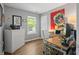 Functional home office space with a modern desk and a large window at 9700 River Oak E Ln, Fishers, IN 46038
