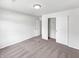 A carpeted bedroom with a closet, providing ample storage space and a neutral palette at 10112 James Run Dr, Indianapolis, IN 46239