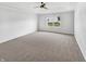 A spacious carpeted bedroom with a ceiling fan and plenty of natural light at 10112 James Run Dr, Indianapolis, IN 46239