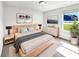 Serene bedroom featuring natural wood furnishings and a sunlit window at 10112 James Run Dr, Indianapolis, IN 46239