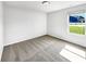 Well-lit bedroom with plush carpeting and a large window offering natural light at 10112 James Run Dr, Indianapolis, IN 46239