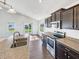 Modern kitchen with stainless steel appliances, granite countertops, and ample cabinet space at 10112 James Run Dr, Indianapolis, IN 46239