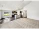 Open-concept living area with hardwood floors, recessed lighting, and a modern kitchen at 10112 James Run Dr, Indianapolis, IN 46239