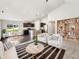 Bright living room with modern furnishings flowing into a sleek kitchen area at 10112 James Run Dr, Indianapolis, IN 46239