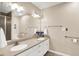 Bathroom with double vanity, updated fixtures, grab bars, and a glass-enclosed shower for accessibility and convenience at 1056 Hilltop Commons Blvd, Whiteland, IN 46184