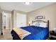 Comfortable bedroom featuring a wrought iron bed frame, soft blue accents, and a closet for storage at 1056 Hilltop Commons Blvd, Whiteland, IN 46184
