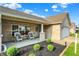 Inviting front porch with comfortable seating and lovely landscaping for a relaxing welcome at 1056 Hilltop Commons Blvd, Whiteland, IN 46184