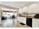 Inviting kitchen with white cabinets, granite counters, and views to dining area at 1056 Hilltop Commons Blvd, Whiteland, IN 46184