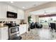 Updated kitchen with stainless steel oven and views of breakfast nook at 1056 Hilltop Commons Blvd, Whiteland, IN 46184
