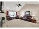 Inviting living room features vaulted ceilings, plush seating, and ample space for relaxation at 1056 Hilltop Commons Blvd, Whiteland, IN 46184