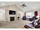 Spacious living room with vaulted ceilings, fireplace, plush seating, and abundant natural light at 1056 Hilltop Commons Blvd, Whiteland, IN 46184