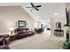 Open-concept living room flowing into the dining area and showcasing comfortable seating at 1056 Hilltop Commons Blvd, Whiteland, IN 46184