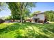 Expansive back yard with mature trees and plenty of room for activities at 106 N Jamalee Way, Pendleton, IN 46064