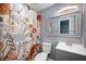 Bright bathroom featuring a single sink vanity, toilet and shower at 106 N Jamalee Way, Pendleton, IN 46064