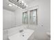 Bright bathroom with a single sink vanity and modern light fixture at 106 N Jamalee Way, Pendleton, IN 46064