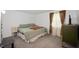 Inviting bedroom with soothing colors, dresser, and bright natural light at 106 N Jamalee Way, Pendleton, IN 46064