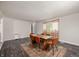 Spacious dining room with modern table and seating, featuring wood floors for hosting dinners at 106 N Jamalee Way, Pendleton, IN 46064