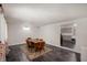 Bright dining room with wood floors, comfortable seating, and a view into the adjacent kitchen creates an inviting space at 106 N Jamalee Way, Pendleton, IN 46064