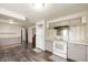 The kitchen features light gray cabinets, granite countertops, and modern appliances for cooking and gathering at 106 N Jamalee Way, Pendleton, IN 46064