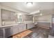 Bright kitchen featuring gray cabinets, granite countertops, and durable flooring provides a clean, modern cooking space at 106 N Jamalee Way, Pendleton, IN 46064