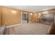 Inviting living room features fresh paint, carpet and an open design flowing into the kitchen with updated cabinets at 106 N Jamalee Way, Pendleton, IN 46064