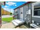 Backyard featuring a grey home with a white door, and a small concrete porch at 11 14Th St, Franklin, IN 46131