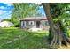 One-story home with well-manicured front lawn and mature trees at 11 14Th St, Franklin, IN 46131