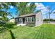 Well-kept house with grey siding, white trim, and a green front lawn at 11 14Th St, Franklin, IN 46131