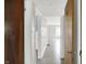 Bright hallway with neutral walls and gray flooring, connecting various rooms with a seamless and modern flow at 11 14Th St, Franklin, IN 46131