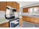 Traditional kitchen featuring wood cabinets, stainless steel appliances, and durable countertops, offering practicality and style at 11 14Th St, Franklin, IN 46131