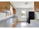 Bright kitchen with wooden cabinets, durable countertops, and updated flooring, offering both style and practicality for cooking at 11 14Th St, Franklin, IN 46131
