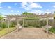 Picturesque backyard patio with brick pavers, pergola, comfortable swings, and privacy fence at 11105 Deer Valley Dr, Indianapolis, IN 46229