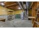 Unfinished basement space with exposed ceiling and multiple storage shelves at 11105 Deer Valley Dr, Indianapolis, IN 46229