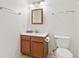 This bathroom features a wood vanity and a framed mirror at 11105 Deer Valley Dr, Indianapolis, IN 46229