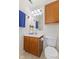 Bathroom with a wooden vanity, mirror, and built-in cabinet at 11105 Deer Valley Dr, Indianapolis, IN 46229