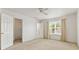 Bright bedroom with a ceiling fan, large window, and walk-in closet at 11105 Deer Valley Dr, Indianapolis, IN 46229