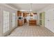 Charming kitchen featuring an island, pendant lights, and easy access to a breakfast nook at 11105 Deer Valley Dr, Indianapolis, IN 46229
