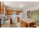A well-organized kitchen with an island and a view into the laundry area at 11105 Deer Valley Dr, Indianapolis, IN 46229