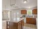 Kitchen featuring an island, lots of cabinet space, and an attached living space at 11105 Deer Valley Dr, Indianapolis, IN 46229