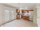 Cozy kitchen with an island, tile floors, and a charming breakfast nook at 11105 Deer Valley Dr, Indianapolis, IN 46229