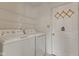 Functional laundry room featuring a washer, dryer, and convenient wire shelving at 11105 Deer Valley Dr, Indianapolis, IN 46229