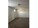 Bright living room with carpet and two doors offering ample access at 114 S Green St, Brownsburg, IN 46112