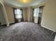 Spacious living room with neutral walls and plush carpeting at 114 S Green St, Brownsburg, IN 46112