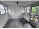 Cozy sunroom featuring multiple windows and a private entry at 114 S Green St, Brownsburg, IN 46112