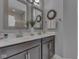 Bathroom with double sinks, granite countertops, and framed mirrors at 1215 W Curry Rd, Greenwood, IN 46143